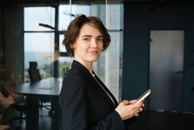 Young businesswoman using mobile phone