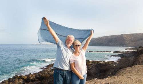 Senior couple enjoying at beach