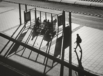 High angle view of people walking on road