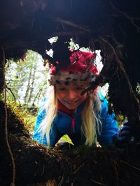 Portrait of smiling girl looking in cave