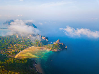 Aerial view of sea against cloudy sky