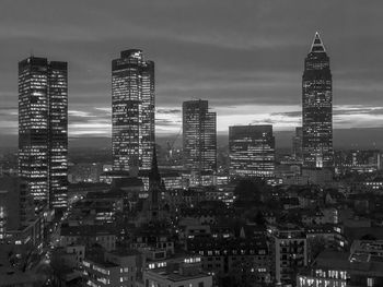 Illuminated buildings in city at night