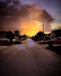 Scenic view of sea against cloudy sky at sunset