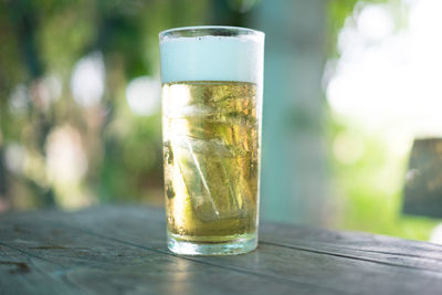 Close-up of beer glass on table