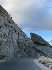 Rock formation on land against sky