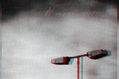 Low angle view of red pipe on wall