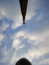 Low angle view of airplane flying against sky