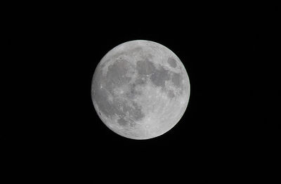 Low angle view of moon against clear sky at night