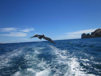 Scenic view of sea against clear blue sky