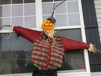 Pumpkin head man scarecrow