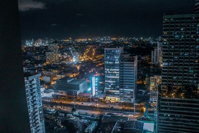 Illuminated buildings in city at night