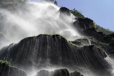 Low angle view of waterfall