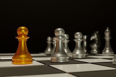 Close-up of chess pieces against black background