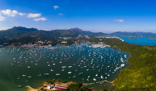 High angle view of sea and cityscape against sky