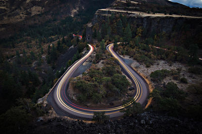 High angle view of light trails on road at night