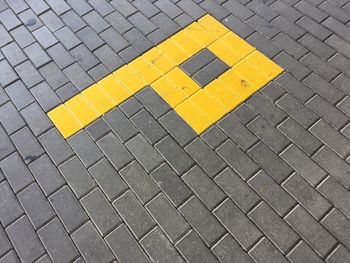 Letter p on paved street