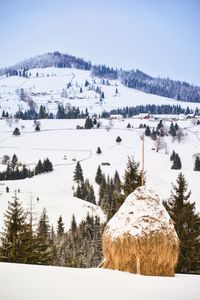 Scenic view of ski lift against sky during winter