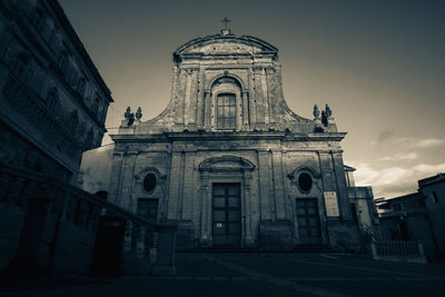 Facade of historic building against sky