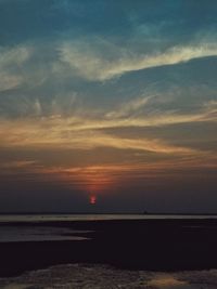 Scenic view of sea against sky at sunset