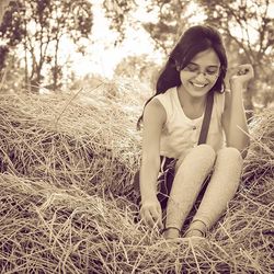 Portrait of young woman in field