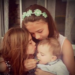 Portrait of happy girl with arms raised