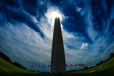 Low angle view of monument against cloudy sky