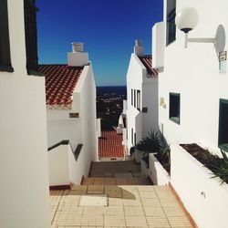 Residential buildings against blue sky