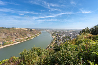 High angle view of river amidst trees against sky