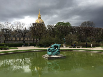 Statue of liberty against cloudy sky