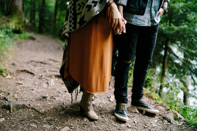 Low section of women standing on ground