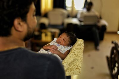 Man holding baby boy