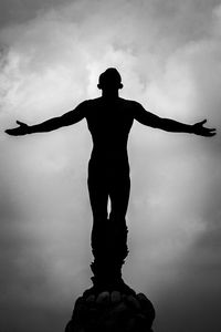 Silhouette of statue against sky