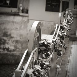 Close-up of machinery on wall by building