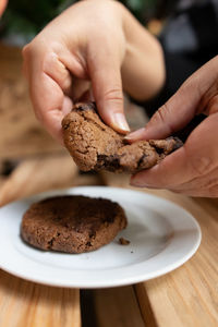 Midsection of person holding cookies