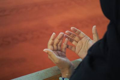 Cropped hand of woman holding hands