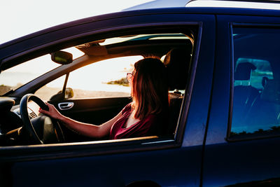 Woman sitting in car