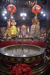 Illuminated statue of building in temple