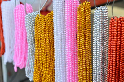 Close-up of pearl necklaces for sale at market stall