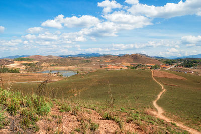 Rural landscape with mountains, fields, village and lake on background. phonsovan, laos.