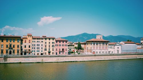 Houses against blue sky in city