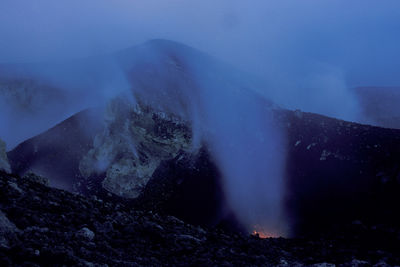 Smoke emitting from volcanic mountain