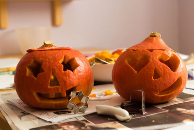 Carved pumpkins on table during halloween