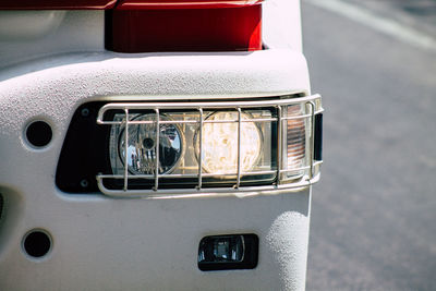 Close-up of vintage car parked on road