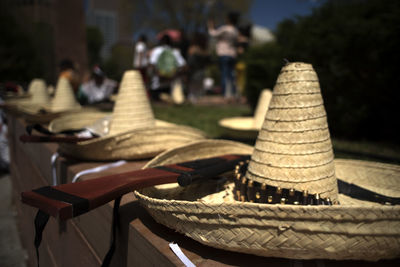 Close-up of hat with weapons on table