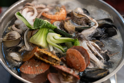 Boiling seafood stew in the pot