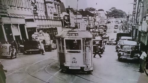 Woman standing on city street