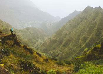 .rocky terrain in front of a incredible panorama view of high mountain. santo antao cape verde