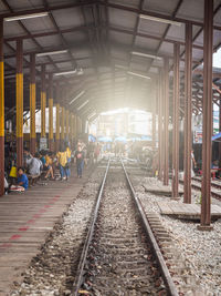 People waiting at railroad station platform