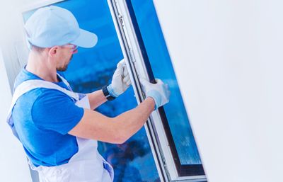 Man fixing window