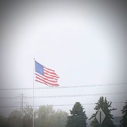 Low angle view of flag against sky